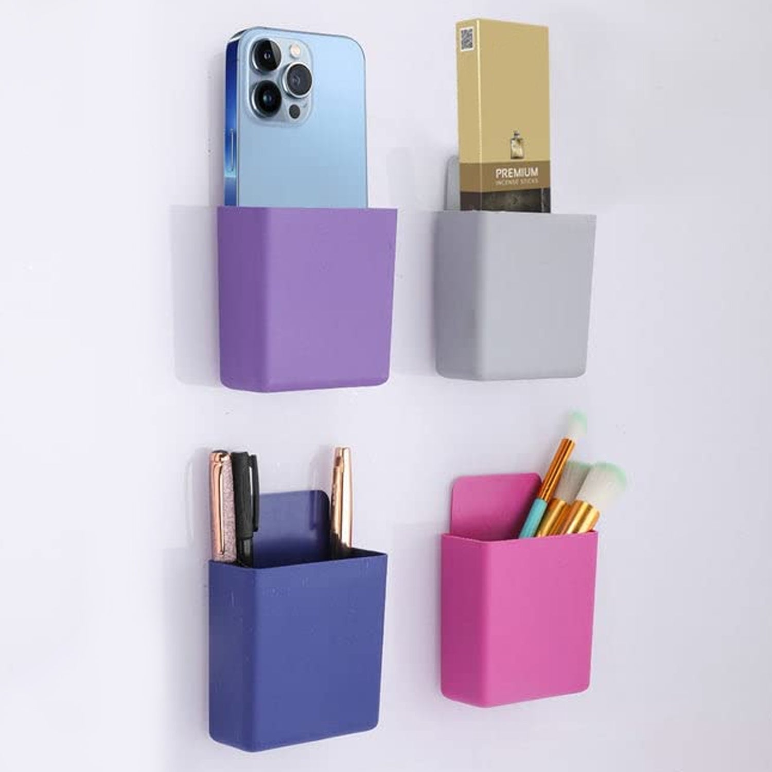 Multipurpose wall holder for storing remote and phone