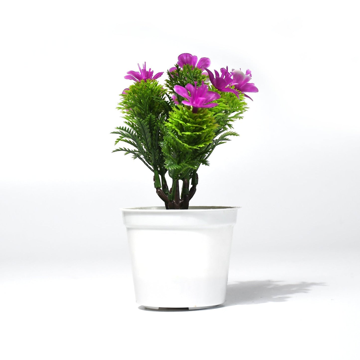 Plastic pot with artificial flowers.